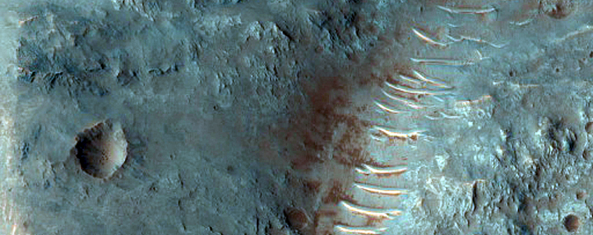 Eastern Portion of Well-Exposed 6-Kilometer Crater in Ladon Valles

