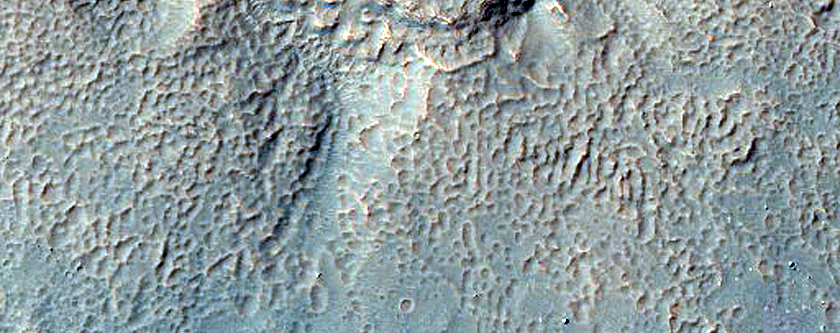 Monitor Slopes of Well-Preserved Crater in Aonia Terra
