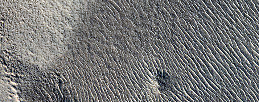 Dipping Layers in Depression in Degraded Crater South of Renaudot Crater
