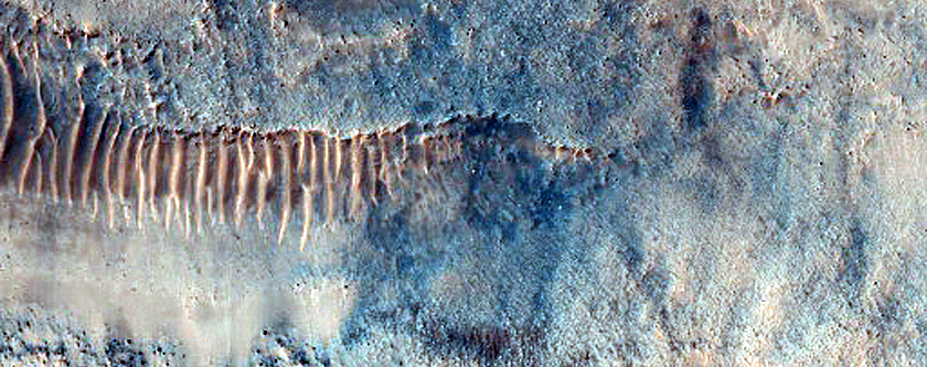 Steep Equator-Facing Slope of Impact Crater
