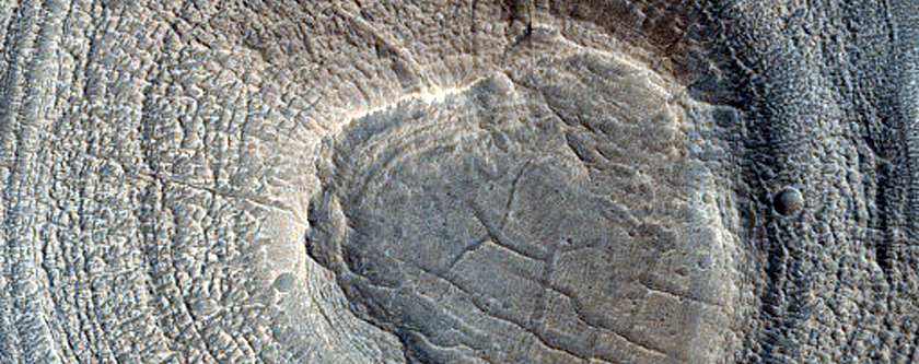 Small Crater with Layered Sedimentary Mound
