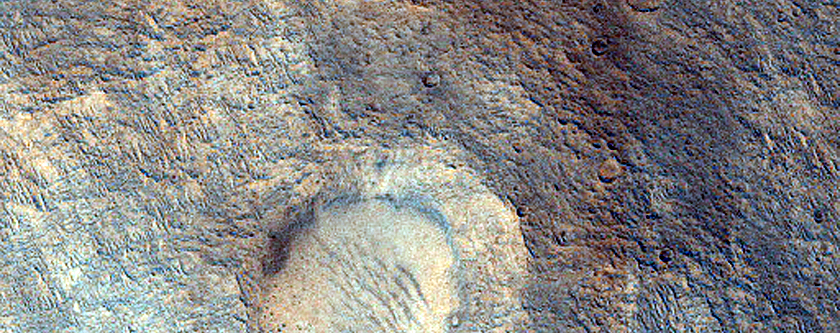 Cone-Shaped Form Cross-Cut by Trough in Lederberg Crater
