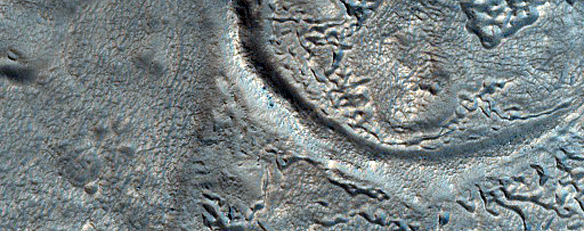 Layered Feature in Crater North of Arabia Region
