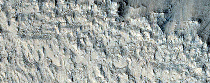 Layers on Pedestal Crater in Tikhonravov Crater
