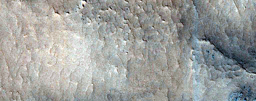 Layered Structure in Crater in Coloe Fossae
