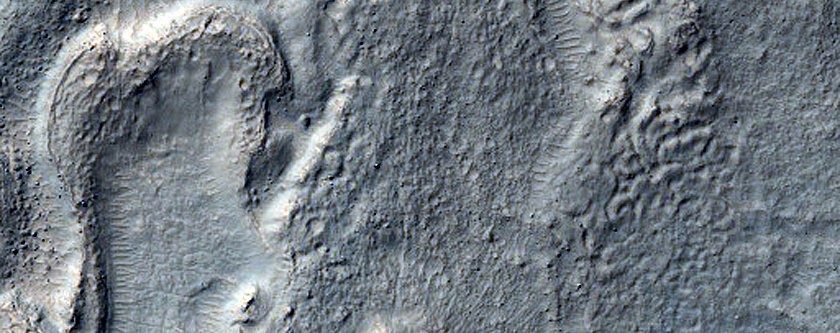 Features in Crater in Promethei Terra
