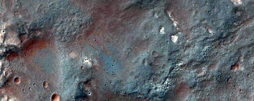 Weathered Ejecta and Pitted Material Associated with Kontum Crater
