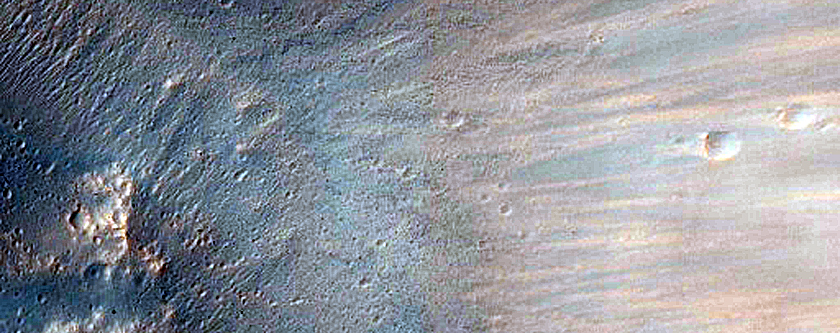 Intersection Between Fresh Crater and Fluvial Valleys
