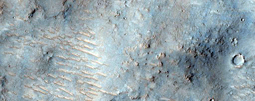 Channel Cutting through Crater in Hesperia Planum
