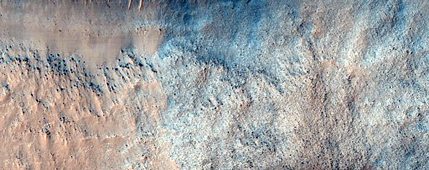 Steep Equator-Facing Slope of Impact Crater