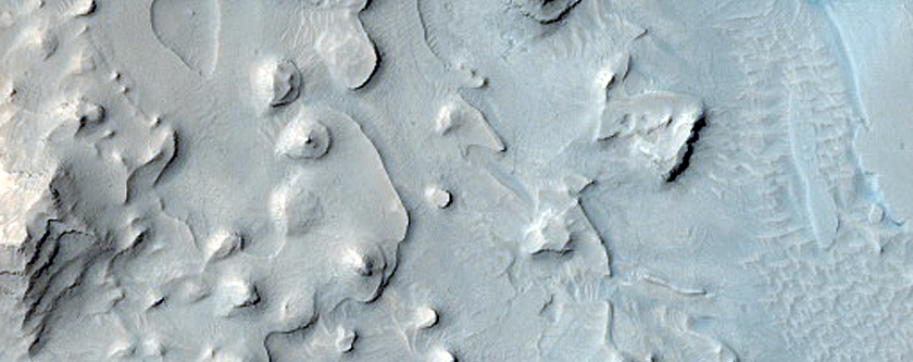 Layered Deposits in Crater in Western Arabia Terra