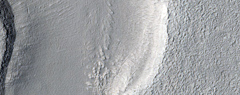 Dipping Layers in Crater in Northern Mid-Latitudes