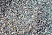 Valley Cutting Crater Rim Southeast of Icaria Planum

