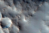 Channel within Larger Channel West of Idaeus Fossae
