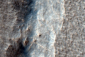 Pit in Mid-Latitude Mantle

