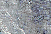 Stratified Materials in Memnonia Sulci
