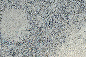 Rough Terrain Exposed from Under Smooth Mantle
