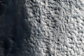 Fluvial Outflows Off of Layered Plains

