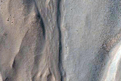 Gullied Crater with Rock Exposures
