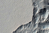 Mantling Material with Scarps
