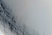 Crater South of Ius Chasma with Material Bright in THEMIS Night Infrared
