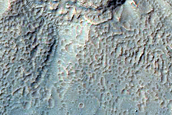 Monitor Slopes of Well-Preserved Crater in Aonia Terra
