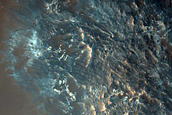 Light-Toned Deposits on Floor of Orson Welles Crater

