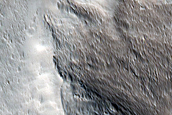 Valley Cutting Crater Rim in Acheron Fossae
