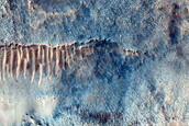 Steep Equator-Facing Slope of Impact Crater
