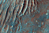 Variety of Light and Dark-Toned Landforms Southwest of Tabor Crater
