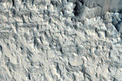 Layers on Pedestal Crater in Tikhonravov Crater
