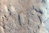 Layered Material in Crater Seen in CTX Image B21_017678_1926
