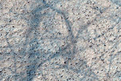 Small Crater in Aonia Terra
