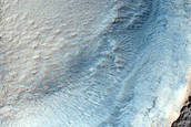 Possible Olivine-Rich Pedestal Crater in Terra Sirenum
