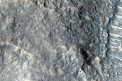 Crater with Butterfly Ejecta and Rocky Interior
