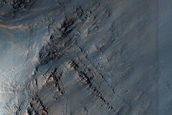 Possible Exit Breaches in Crater with Preserved Ejecta Texture

