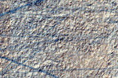 Layered Deposit in Small Crater in Hellas Planitia

