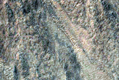 Gullies in Northwest Lowell Crater Wall Originating at Bouldery Deposit

