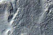 Features in Crater in Promethei Terra

