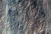 Gullies in Northwest Lowell Crater Wall Originating at Bouldery Deposit

