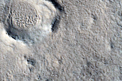 Dipping Layers in Craters in Northern Mid-Latitudes
