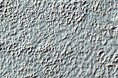 Fan and Scarp on Crater Floor in Aonia Terra
