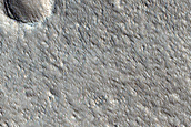 Boundary Between Acheron Fossae Upland and Adjacent Plains
