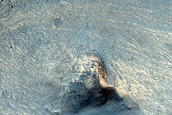 Ganges Chasma Wall at Edge of Innsbruck Crater