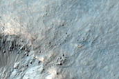 Fresh Small Impact Crater on Rim of Much Larger Crater