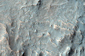Crater Wall Exposure of Layers within Larger Crater Fill