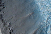 Pitted Materials and Ejecta along Rim of Crater in Acidalia Planitia