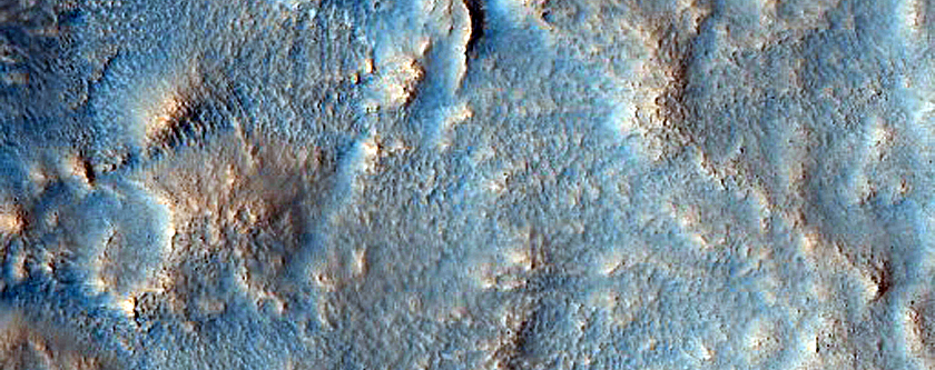Possible Melt Bearing Deposits around Mohawk Crater