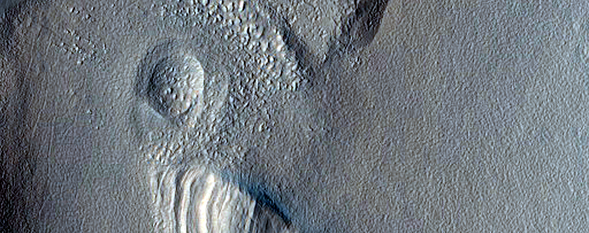 Layered Structure and Depression on Rim of Moreux Crater