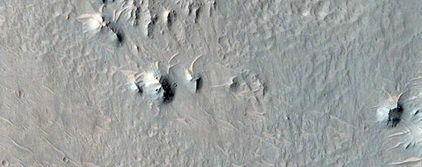 External Ponded and Pitted Materials off Western Rim of Mojave Crater